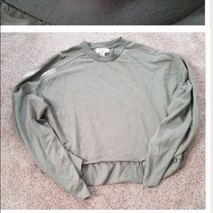 a cropped green hoodie